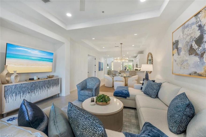 Stunning top-floor penthouse condo in the premier bundled-golf community of Naples Lakes Country Club. This beautifully decorated two-bedroom plus den residence has been meticulously cared for and is in truly outstanding condition, offering immediate golf privileges upon ownership.

Light and bright with a fresh coastal-inspired design, sunshine pours through the windows, creating an inviting and serene atmosphere throughout. The home features an updated kitchen with modern appliances, along with updated bathrooms, flooring, lighting, and more, reflecting pride of ownership at every turn.

Enjoy the privacy of a top-floor unit with no one above you, a spacious two-car garage, and a large screened lanai showcasing water views, the 16th green, and breathtaking sunset vistas—the perfect setting for relaxing or entertaining.

Naples Lakes Country Club offers an exceptional lifestyle with rich amenities, including a championship Arnold Palmer Signature Golf Course, newly constructed pickleball courts, tennis, bocce, fitness center, driving range, putting greens, and outstanding dining options.

Ideally located just minutes to Naples beaches, 5th Avenue South, Marco Island, and approximately 30 minutes door-to-door to RSW Airport in normal traffic. Turnkey furnished—just pack your bags and move right in.