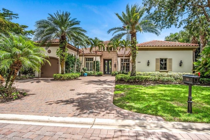 Updated and immaculately maintained 3 car garage single family home in prestigious Grey Oaks! Attention to detail will be clear when you walk through the custom designed iron and wood front doors. All new Legno Bastone engineered hardwood floors, gas appliances, and soaring ceiling heights. Large kitchen with Viking Appliances, gorgeous wet-bar with ice-maker, and a walk-in pantry. Tons of counter space including a full prep island. The family room extends to the outdoor covered lanai with outdoor kitchen and fireplace. Walk right into the wading area of a free form black salt water pool with a natural stone spa and waterfall surrounded by lush landscaping in your own tropical paradise. With southern exposure, a tranquil lake view, and thoughtfully placed landscaping you have both view and privacy. All bedrooms are full en suite and rooms are split so you have plenty of privacy for both owners and guests. The Master suite has everything you would expect with 2 custom closets, seating area, and gorgeous views of the lake and pool area. Grey Oaks is close to downtown events, shopping, and restaurants and the amenities on site are a MUST SEE! Schedule your private tour today!