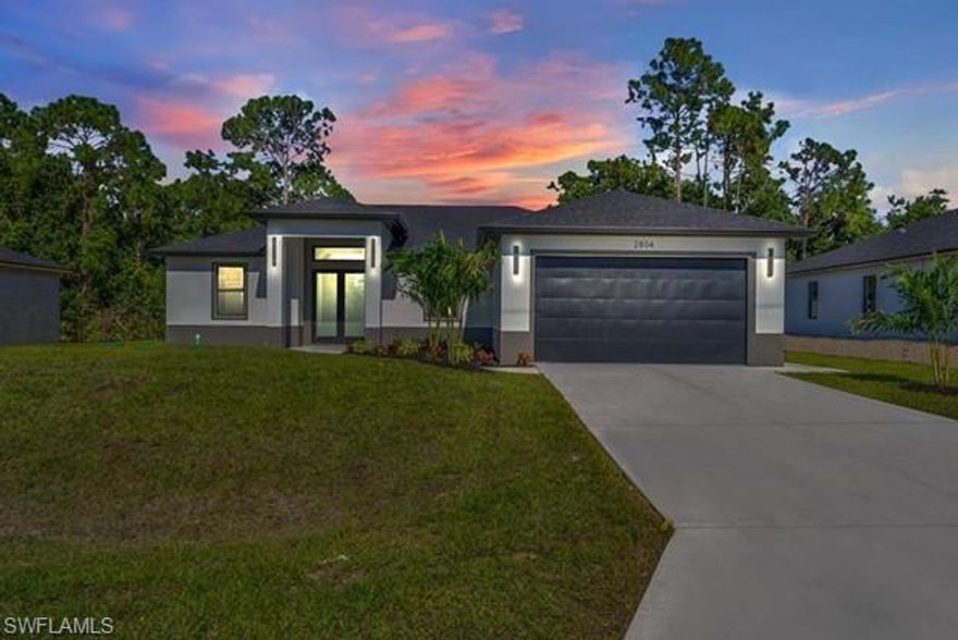 MOST AFFORDABLE PRICE PER SQFT IN LEHIGH. SELLER CONTRIBUTION AVAILABLE UP TO 10K. Introducing a stunning example of
contemporary luxury living: this beautiful new construction boasts a modern aesthetic that is both chic and functional. Step into the spacious
kitchen, featuring a sleek L island with samsung bespoke stainless steel appliances and touch screen samsung fridge and quartz countertops,
perfect for cooking and entertaining. European-style kitchen cabinets provide ample storage, complementing the clean, minimalist look.
Throughout the home, porcelain tile flooring adds elegance and durability. In the bathrooms, LED light mirrors combine style with practicality for
a truly indulgent experience. With four bedrooms and two and a half bathrooms, including a master suite with his and hers walk-in closet and
double sink and an elegant walk-in shower, comfort and luxury abound. From the floating modern vanities to the European style closet doors,
every detail has been carefully curated for modern living at its finest. And with an extended lanai and sleek finishes, calling this paradise is an
understatement. Automated water irrigation for grass included. Pictures are a model.