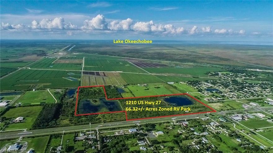 Located on busy US HWY 27, this 66.31+/- acre property zoned and entitled for up to 250 RV / Motorcoach lots + 1,500 feet of Potential Commercial frontage on US Hwy 27, This includes 2 lakes, for lakefront sites. Access to city of Moore Haven utilities including central water & sewer is available. With easy access to the Caloosahatchee River, and Lake Okeechobee, in a central location on State Hwy 27 with direct access to Central & South Florida, this location is ripe for development! (Seller financing also available with sufficient down)