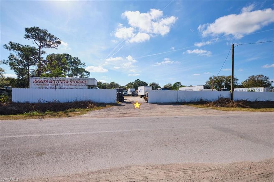 Prime 1.04± Acre Heavy Industrial Lot With Full Fencing, Utilities, and Dual 20x30 RV Carports

Unlock functionality and visibility with this improved Heavy Industrial parcel located on Industrial Loop in the rapidly growing LaBelle market. Zoned I-2 Heavy Industrial, this 1.04± acre property is ideal for manufacturing, logistics, equipment storage, contractor operations, or other commercial uses requiring ample space and robust infrastructure.

Featuring almost 200 feet of paved road frontage and over 200 feet of depth, the lot offers plenty of room for more buildings, office space, vehicle flow, or any future expansion. The property is fully fenced for security and equipped with electric and water already onsite, providing immediate operational capability. Two oversized 20x30 RV-style carports with enclosed rear sides offer covered parking for large vehicles, machinery, or materials—perfect for businesses needing protected storage.

Located just outside LaBelle city limits, the property benefits from proximity to local amenities without city taxes. Neighboring active industrial and commercial businesses, the lot sits only steps from LaBelle Airport, within walking distance of Highway 29, and just minutes from Highway 80—offering excellent regional connectivity.

LaBelle continues to experience significant growth, making this a strategic time to invest in industrial real estate. This central Southwest Florida location puts you roughly 20 miles from Fort Myers, 1.5 hours to Florida’s east coast, 2 hours to Miami, and about 2.5 hours to Orlando and Tampa.

A rare opportunity to secure a fully equipped, high-visibility industrial site in one of Southwest Florida’s fastest-growing markets—ready for immediate use!