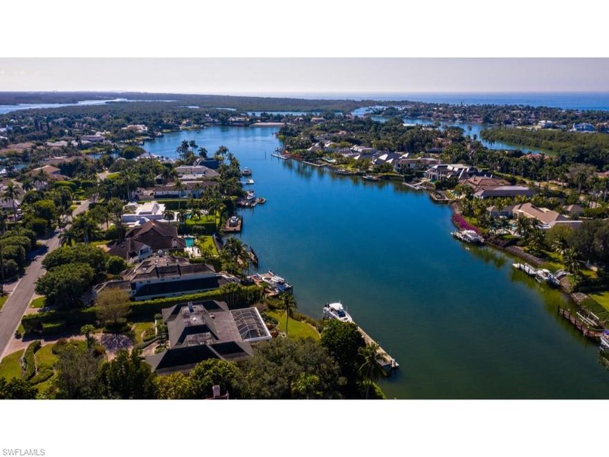 A remarkable lot and one half located on Gin Lane.  Highly sought after western exposure and gorgeous long southwesterly water views over Smugglers’ Bay. This expansive building site permits a significant building envelope. Existing home being sold in its “As-Is” condition. Enjoy no bridge access to the Gulf of Mexico and the inland waterways leading to the magnificent estuaries of the Ten Thousand Islands. Port Royal Club membership eligibility.