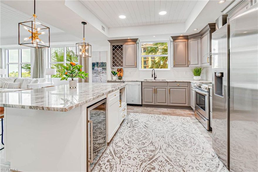 Wow! Completely remodeled & FURNISHED condo in a luxury high-rise with incredible river views! Step through the front door & fall in love with the bright & open layout, with views of the water all around you. Upgrades include new plank tile flooring throughout, re-designed kitchen layout with large island, granite counter-tops, new stainless steel appliances, tile backsplash, custom woodwork including shiplap in the tray ceilings, and a fireplace in the living room! The master retreat has sliding doors to the screened-in balcony, allowing you to enjoy the views from bed! The master bathroom has a new vanity with dual sinks and a stunning shower with frameless glass door. You have two additional guest rooms with a Jack and Jill bathroom, and a third full bath. As if that wasn't enough, there is a private den with sliding pocket doors and it's own separate balcony, easily converted into a fourth bedroom! Located in the Beau Rivage in downtown Fort Myers, it is convenient to shops, restaurants, and entertainment! Community amenities include pool, spa, tennis, pickleball, fitness center, a community gathering room, and guest suite available on a first come first serve basis.