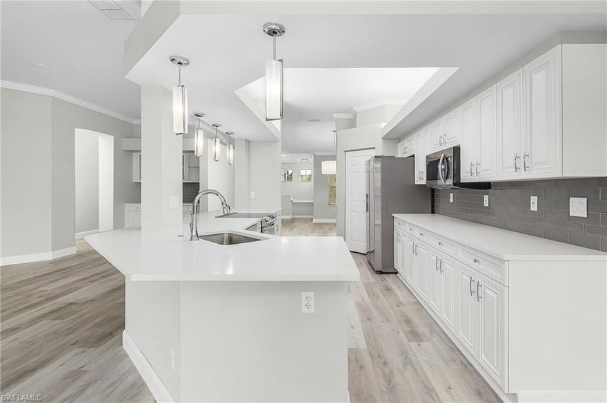 Absolutely stunning water view from this beautifully renovated 3 bedroom, 2 bath condo with a 2 car garage & private driveway.  This home has plenty of space with the open floor plan, high ceilings, large bedrooms, living room, dining room plus it feels like single family living!  Take advantage of the stunning kitchen open to the family room, fireplace and bar!  Lighthouse Bay has a plethora of amenities tennis, paddle boat, kayaking on the interconnected lakes, resort style pool, fitness and so much more.