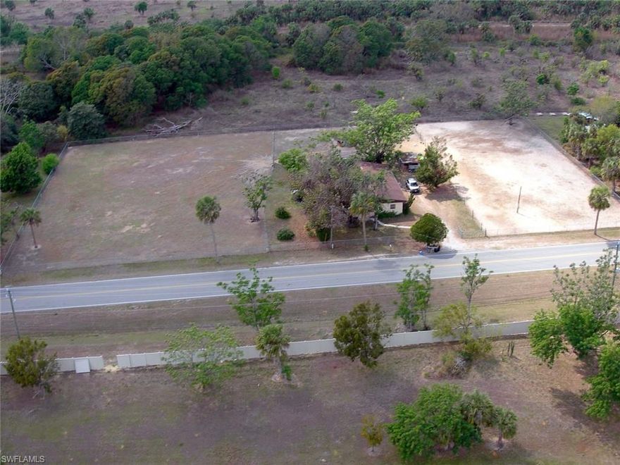 This one of a kind, Old-Estero Gated Goat Farm owners are moving on.  Amazing 1.694 acre PARCEL zoned Ag 2/Single family residential, in the heart of The Village of Estero, off Sandy Lane, West of I75 and East of US41. Property is currently being used as agricultural, with goats and chickens. Generous sellers are saying "we'll throw in the livestock".  This Old Florida Style home was built in 1960 is currently occupied. Lots of changes are occurring now along Sandy Lane and East Broadway, as well as along the river frontage of US41, Corkscrew and Sandy Lane. Property lines are 360 x 205 = 1.694, and right of way easment of 360 x 30 = .248 acres.   This property is "high and dry", and has well and septic. Estero is booming with growth and development and this property gives you immediate access to all of these great amenities...beaches, malls, recreation, airport, interstate, FGCU, top ranked schools, grocery centers and restaurants, centrally located between Bonita Springs and Fort Myers.