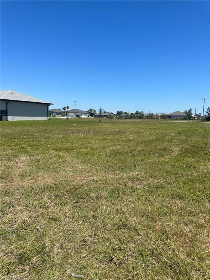 Welcome to your dream residential lot. This large 80' wide by 125' deep lot is the perfect blank canvas to build your dream home. With city water and sewer already connected, this lot is ready for you to start planning your dream home.

This is the best priced buildable lot in the area, surrounded by newly built homes and even more homes that are under construction in the area. You'll be surrounded by a beautiful neighborhood with a community feel.

Location is key and this lot is conveniently located just a short walk away from Jim Jeffers Park and Christa McAuliffe Elementary School, or a three-minute drive by car. You'll also be within walking distance of Publix, Walgreens, and restaurants, making errands and dining out a breeze.

This lot is close to Pine Island Rd, providing easy access to excellent fishing in Bokeelia and Matlacha. You'll be able to enjoy all the best of Florida living right from your own backyard.

Don't miss your chance to own this amazing residential lot in Cape Coral. Start living your Florida dream today!