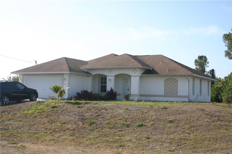 Perfect home for a growing family.  Large, 4 bedrooms with a den and 2 bathrooms. Cathedral ceiling with plant shelves.  Large master suite with separate shower and garden tub.  Large walk in closet. Den is large enough to become an additional bedroom and has window seat.  Room for a pool.  Located on a quiet street in Lehigh Acres.  Close to schools, shopping and RSW Airport.