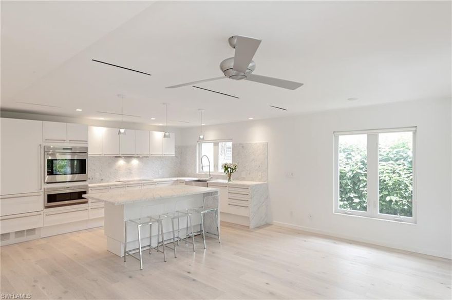 H.13372 -A rare find! For the buyer looking for designer features in a contemporary North Naples beach home. Architect designed renovation from top to bottom, this open, light filled home boasts premium wide-plank hardwood floors and luxury features such as custom Poggenpohl integrated kitchen, Wolf oven, microwave & cooktop, Subzero refrigerator, Carrera marble backsplash, counter and waterfall island. Gorgeous Blanco sink, Axor Starck kitchen and bathroom faucets, Duravit bath fixtures including soaking tub, Meile dishwasher, Artemide lights & front loading Bosch washer/dryer. Bedrooms feature built in Poggenpohl closets. Carrera marble floors in baths & laundry. High impact PGT windows & doors, AC w/custom diffusers. Custom window treatments. Situated on well-maintained landscaped lot and located in the desirable 500 block. Walk or ride to beach, Mercado restaurants and shops.