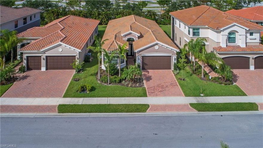 Huge Price Reduction!   Private views in this Chandon model built in 2015 offers over $100K in builder and after-market upgrades. This home features 3 bedrooms, 3 baths and a den (with closet-option for 4th bedroom). The kitchen boasts granite counters, GE Profile stainless appliances, full granite back splash and upgraded cabinets with roll-out shelves and state of the art faucetry. The enhancements made to this home are: Custom closets, built in pantry, custom office cabinetry, high end ceiling fans and fixtures, custom window treatments with room darkening, impact glass on front of home and remote motorized top of the line hurricane shutters everywhere else (including lanai), LED lighting, diagonal tile in all main areas, and state of the art audio visual system including 4 HDTV’s + Apple TV included here. The extra deep lot would accommodate pool and back yard area and beyond is normally very quiet. The 9,500 sq. ft. Clubhouse includes, fully equipped fitness center, indoor sports complex, resort style pool, tiki hut, spa, wet play wading pool for the children, party pavilion, tot lot, 4 pickle ball courts 3 lighted tennis courts and 2 bocce ball courts.