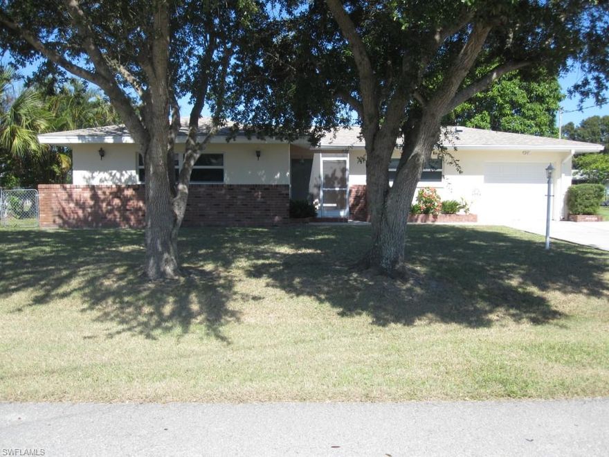 This sailboat-ready saltwater canal house is all about LOCATION.  The property is in the most desirable area of the Cape and is only minutes from the river and Gulf.  Use the desirable lot to build your dream house or wait a while and enjoy the immaculate, well taken care of house.  The windows are hurricane rated and the lanai is completely enclosed so it can be enjoyed year-round.  With the open floor plan, the house feels bigger than normal.  Rotary Park is just down the street and you will be a bike ride from Tarpon Point Marina.