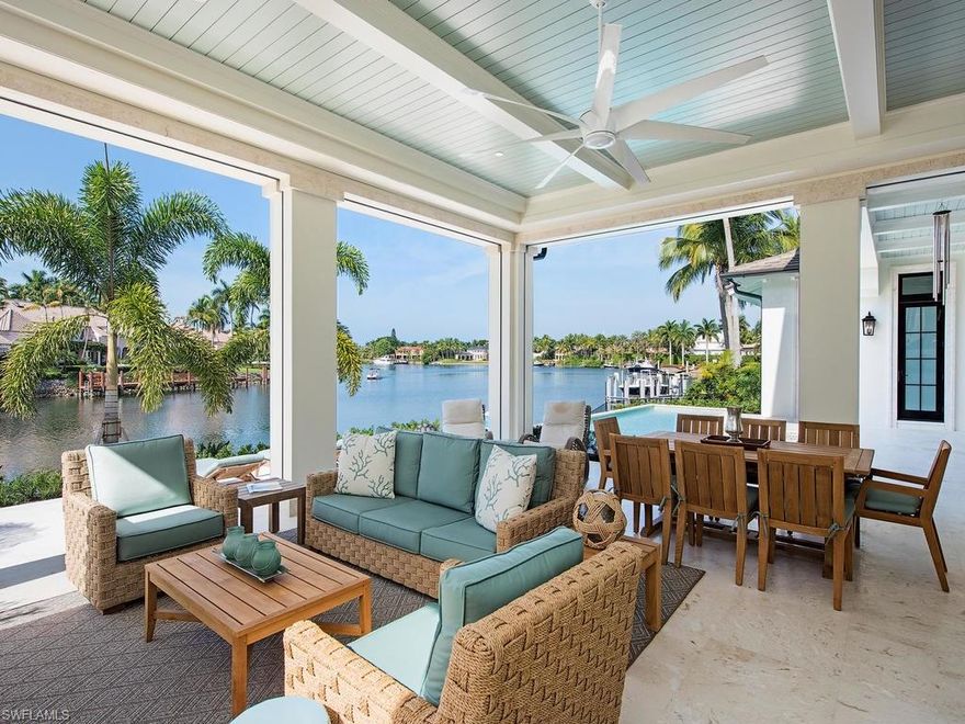 Enjoy the Port Royal Lifestyle. This beautiful custom home was completed in 2016 with 120 ft of water frontage. Constructed by The Williams Group, this timeless home designed by Stofft Cooney boasts one of the longest views of Morgan's Cove and is just a short walk to the Port Royal Club and the sugar sand beaches of the Gulf of Mexico.  No detail was overlooked.  The entry foyer with it's grand staircase, substantial millwork and 24 ft. nickel groove ceiling leads you to the large Great Room with custom built-in's. The approximately 2500 sq ft. of  outdoor living space includes infinity spa, large pool, outdoor living room with fireplace and kitchen.  The stunning white on white chefs kitchen offers state of the art appliances, (including a 60 inch Viking range) a wall of windows and white honed marble countertops. Outside of the kitchen is a butler pantry and bar which is adjacent to an elegant dining room perfect for entertaining, including a custom wine room which will accommodate 1000 bottles of wine. There are 11 ft. ceilings throughout much of the home.  Custom doors lead to both upper and lower expansive living spaces.  Offered decorator furnished.