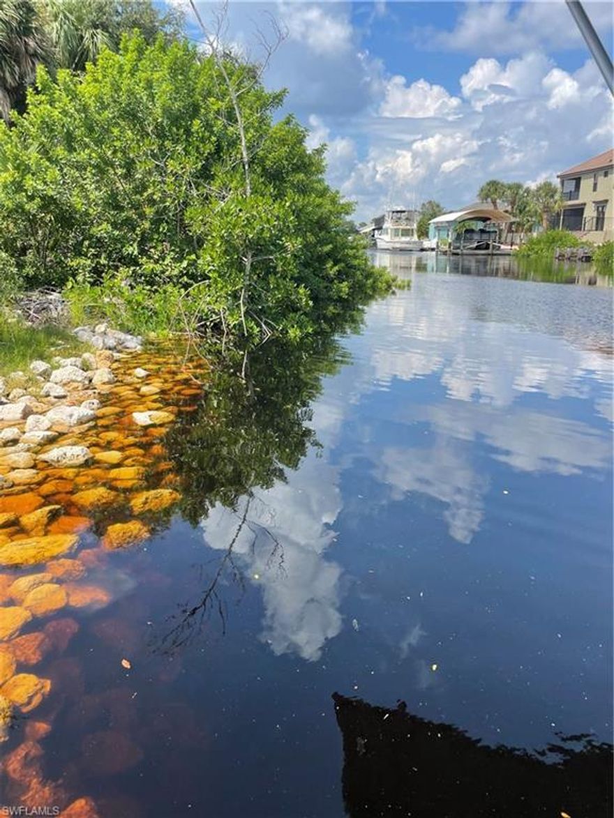 CLEARED, SAILBOAT-ACCESS WATERFRONT LOT*** Perfect residential lot with Gulf access and public water & sewer in place? Here is your chance to own this 80' x 125' lot in a desirable neighborhood- south of Edgewater Drive with established homes nearby. This land has NO BRIDGES out to the Gulf of Mexico, Charlotte Harbor and the Myakka River!  Convenient access to the Town Center Mall, Sun Seekers Resort, restaurants, shopping and dining.   Enjoy the SW Florida lifestyle with an abundance of golfing, boating and fishing, as well as the Charlotte County Sports Stadium, plus, only a 30 minute drive to pristine Gulf Coast Beaches. Survey available & on public sewer & water! Don't miss this opportunity!