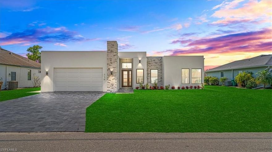 New Construction Modern Luxury Home. This is Dec/2025 home features 2,108 SF of living room with 3108 SF under roof with 2 Bedrooms + Den that can convert to bedroom easily, 2 Full bathrooms, and a large 2 Car Garage. Located on the canal with new boat lift and loaded with features and upgrades rarely offered in most new homes, blending the lines between contemporary elegance and comfort. Open concept with large format 48x48 flooring, contemporary lighting and fans, high ceilings, vents, and sliding glass doors and windows overlooking around the house with a lot of sunlight. Entertainer's Kitchen with Mitered Edge Quartz Countertops, center island with waterfall edges and stainless-steel, dark European style cabinetry, wall oven, stainless steel appliance package, modern pendant lighting, and window in the kitchen for natural lighting. Cabinets bring a styling and modern look you won't find in "standard homes". The master bedroom feels like you are staying at a luxury resort, Master Bathroom feels more like stepping into a LUXURY HOTEL SUITE, open walk-in shower, CLOSET walk-in closet. Amble space for family. An office can be by the front entry. Your Oasis is completed by an incredible outdoor living space. High-end construction with full stucco ceilings, large tie-beams for NO PILLARS obstructing your view and patio space. Large backyard with place for pool or Jacuzzi.  It will make you excited to call this HOME and leave your guests and family breathless when they visit. City Water & Sewer in. impact windows and doors, elevated new construction, built to be modern and safe. There is no comparison, this home features materials often reserved for high-end waterfront homes!