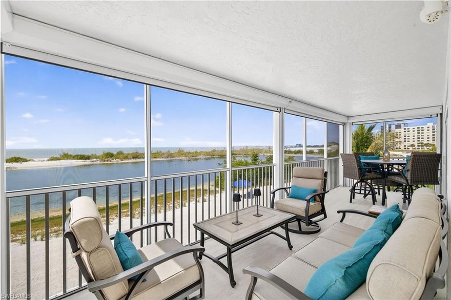 This breathtaking 1,388 sq. ft. BEACHFRONT condo combines modern luxury with a relaxed coastal vibe, offering unobstructed Gulf views and complete privacy, no neighbors to deal in your view. Fully remodeled and exquisitely furnished, the unit features a wrap around lanai, one side facing the Gulf the other side facing the southern view of Fort Myers Beach, perfect for soaking in panoramic views of the beach from sunrise to sunset. The west-facing lanai, accessible from the bedrooms and living room, provides a serene spot to enjoy morning coffee while overlooking the lush tropical garden, sun soaked pool, and shimmering waters.  High-impact soundproof sliding doors connect the lanais to the interior, which showcase a custom European kitchen with quartz countertops, floating shelves, and ocean views, along with tasteful furnishings, luxury vinyl flooring, and newly installed motorized Kevlar fabric hurricane shutters for protections and privacy. The master suite is a private retreat with an elegant ensuite featuring a double vanity, an additional single vanity, and a walk-in glass shower with marble countertops. A second bedroom and updated bathroom ensure ample space for guests. Additional highlights include a new AC system (2023), updated electrical panel, newer water heater, electric Kevlar hurricane shutters,  and new Italian tile on the lanai. The building updates include a new roof, new elevator and new pool equipment. The property also comes with a deeded concrete carport for convenient access to the side entrance and an 8x8 storage shed for beach gear. Nestled within a tropical garden courtyard, the community amenities include a gourmet grill area, a newly resurfaced shuffleboard court, and an oasis-style pool surrounded by luxurious loungers and Tucci umbrellas, all with a large patio deck facing the ocean. This condo is the ultimate beachfront retreat, blending sophisticated style with the beauty of oceanfront living.