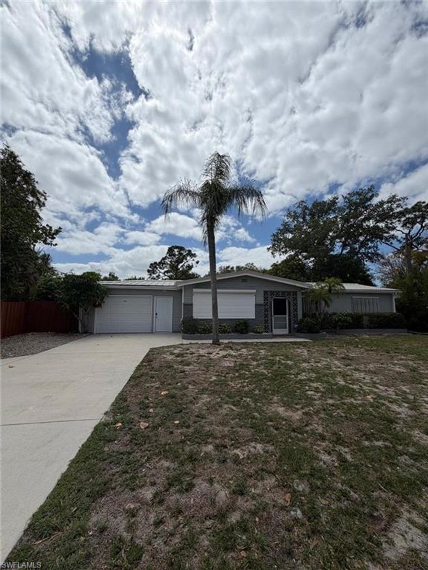 Beautiful 3BR/2BA home with 1,560 sq ft in San Carlos Park, within walking distance to US-41 and under 10 minutes to I-75. Major updates include roof (2021), A/C (2020), electrical (2022), and shutters (2024). Features a fully fenced yard, two sunrooms, and a spacious backyard (oversized lot). Flexible layout with a room that can serve as a mother-in-law suite, plus a spacious garage with epoxy finish, vinyl flooring throughout, and a home security system with cameras. The reinforced 6+ inch driveway accommodates heavy trucks or motorhomes, and includes an RV hookup that can double as an EV charger. Plenty of room for parking RV, trailer, or even a boat. Don't miss the opportunity to own this home in San Carlos Park, priced to sell, seller motivated, call for private showing!