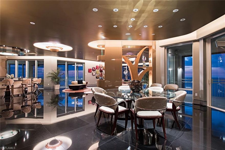 Exquisite architectural detail and fine finishes are evident from the moment you enter this one-of-a-kind contemporary residence. Its top-of-the-world location affords endless water and city views from virtually every room and offers the space, functionality and privacy of a lavish, single-family home with the innumerable advantages of an amenity-rich luxury beachfront condominium. Plenty of natural light bathes the interior spaces through ten and a half foot window walls of glass. The uncommon elegance of the main living areas is highlighted by extraordinary custom ceiling details, lighting, cabinetry, a handcrafted bar and master suite and bath that are a haven of luxury. Two large terraces expand the living area allowing for wonderful flow-through breezes. Included is a rare private cabana on the pool terrace and three perfectly located parking spaces in the enclosed garage.