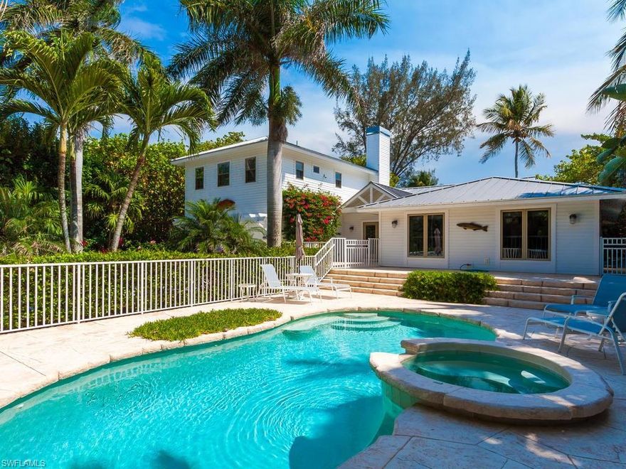 This exquisite 4 BR, 3 BA beach house is perfectly situated on the Gulf ridge near the end of prestigious West Gulf Drive. A double door entry opens to a stunning great room w/stone fireplace, cypress wood floors, vaulted wood ceilings & Gulf views over the open stone patio & back lawn area. Sophisticated choices in finishes & furnishings exude pure, relaxed & warm Sanibel Island ambiance throughout. An airy & open eat-in kitchen wrapped in white wood cabinetry & quartzite features double breakfast bars, a pantry & Gulf views. The first floor has 3 BRs & 2 baths including a Gulf side BR suite w/bath & walk-in closet. The entire second floor is a private master retreat with beamed light wood ceilings, walk in closet & a luxurious bath which has both a soaking tub & shower. The open pool/spa area is nestled in tropical landscaping & away from the beach for privacy. This home has a metal roof, impact glass windows & large double garage w/plenty of storage. Offered furnished & equipped. Sanibel Island offers a unique combination of man living in harmony with nature. It’s a masterpiece of shells, soft white sand, soothing Gulf beaches and incredible natural beauty.