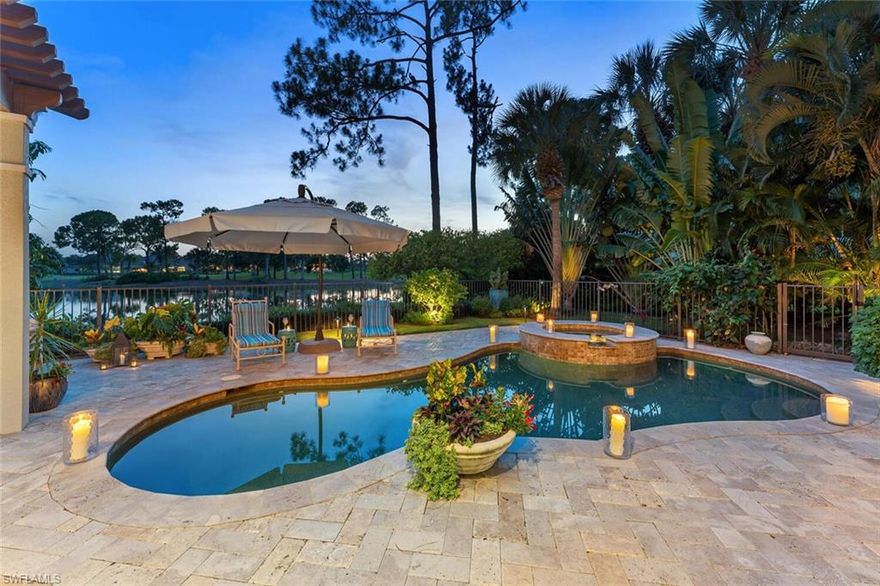 Rarely does a residence come available with such panoramic, quiet, private, lake and golf course views...and IMMEDIATE GOLF MEMBERSHIP.  This rarely-available villa has everything one could ask for: updated kitchen with quartz counters, gas range, custom island, whole-house reverse osmosis, new Master bath, powder room, new roof in 2018, new fireplace in the living room, hardwood floors in many rooms and serene views from almost every room in this home. The extended lanai comes complete with outdoor kitchen, custom, stone fire pit, pergola, fountains, pool and spa, and plenty of room for dining al fresco, while taking in the scenery of your very own resort backyard. There are thoughtfully placed fruit trees on the property which include mango, limes, lemons and bananas...imagine the cocktail concoctions you could be inspired to make, as this residence is made for enjoying and entertaining family and friends.  After a day of shopping, pickle ball or golfing, you'll be looking forward to the evening...watching a gorgeous sunset, listening to the birds calling it a day as well! Grey Oaks has world-class amenities with three golf courses and everything one could wish for. Welcome home!