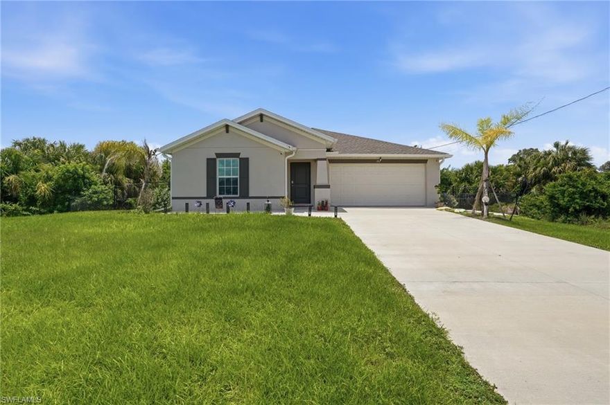 Welcome to this stunning newer construction home offering 3 bedrooms, 2 bathrooms, and a long list of thoughtful upgrades throughout. From the moment you arrive, you’ll appreciate the added concrete slab at the entryway, beautifully maintained landscaping, full gutter system, and fully fenced backyard with gates on both sides for added convenience and privacy.

Inside, the home features vaulted ceilings, quartz countertops throughout, stainless steel appliances, a new kitchen faucet with a single basin sink, crown molding above the kitchen cabinets, soft-close drawers and cabinets, and upgraded soft-closing toilet seats throughout the home. The laundry room includes a deep freezer that conveys with the property.

Step outside and enjoy your own private backyard retreat featuring a stamped concrete patio that has been colored and sealed, a gazebo with a metal roof, relaxing jacuzzi on the lanai, and a custom automatic SunSetter awning with remote control and high-wind safety features — perfect for enjoying the Florida lifestyle year-round. An added sidewalk extending from the front to the back of the home adds both functionality and curb appeal.

Built with impact windows and doors for peace of mind, this home combines comfort, style, and practicality. Conveniently located near the growing Daniels Parkway and SR-82 corridor, with exciting mixed-use and retail expansion happening nearby in the Fort Myers/Gateway area, providing easy access to shopping, dining, entertainment, and more.