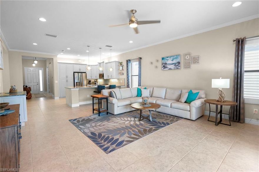 Experience refined Florida living in this impeccably maintained residence nestled within the highly sought-after Marina Bay community. Built in 2017 and enjoyed only seasonally, this home shows like new from the moment you enter, reflecting exceptional pride of ownership and meticulous care throughout.  Offering over 2,200 square feet of thoughtfully designed living space, this immaculate 3-bedroom plus den, 2.5-bath home is ideally situated on a premium lot with tranquil preserve views and coveted southern exposure. The open-concept layout is perfect for both everyday comfort and entertaining.  The chef-inspired kitchen is a standout, featuring white cabinetry, granite countertops, soft-close drawers, upgraded stainless steel appliances to include a convection oven, wine cooler, and a generously sized center island—ideal for gathering and hosting. Additional highlights include a central vacuum system, plantation shutters, crown molding, accordion storm shutters, and an extended lanai that invites seamless indoor-outdoor living.  Residents of Marina Bay enjoy world-class, resort-style amenities, including a 12,000-square-foot clubhouse, resort pool with cabanas, lap pool, splash pad with water slides, children’s play area, four tennis courts, four pickleball courts, a fully equipped fitness center, craft and multipurpose rooms, card and billiard rooms, and indoor/outdoor basketball courts. This staffed, gated community offers exceptional security and peace of mind.  Conveniently located less than 10 minutes from RSW International Airport, with quick access to I-75, premier shopping and dining, and FGCU, this home is the perfect opportunity to escape the cold and embrace the warmth and lifestyle of Marina Bay.