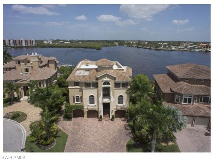 Dramatic wide bay views highlight this palatial waterfront estate. Just steps to the beach, in the gated enclave of Southport on the Bay, within Barefoot Beach. The open floor plan is accentuated by sliding pocketing window walls from the kitchen and great room- opening the living areas to the most panoramic bay views.  Other outdoor features include: Logia with fireplace, summer kitchen, infinity edge pool and spa, insect mist system and large sundeck.  Construction features concrete block, with impact resistant doors and windows. Room for all the toys with 3 plus garage spaces, large dock with 2 boat lifts and wave runner dockage.  The interior boasts 7365 of A/C space. The master bedroom is spacious and open with sliding pocket doors, with an additional 5 bedroom suites, recreation room and fitness area enhance entertaining for any size family.  Other features include: elevator, marble flooring, venetian plaster walls, volume coffered ceilings with recessed lighting. Barefoot Beach is located in the NW Corner of Collier Country, the perfect location.