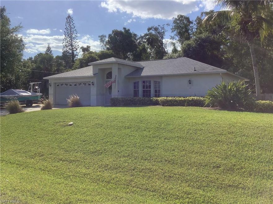 Very well maintained CLEAN San Carlos home.  The home boast an open floor plan which allows for activities and entertaining.  The updated kitchen is light & airy with newer appliances, the laundry room is just off the kitchen for easy convenience.   The dark tile planking floor running through out the living areas definitely complements the color of the kitchen.  There are large baseboards through out the home, with carpet in the bedrooms, both baths are updated including granite vanities.  Master suite has separate walk in closets and sliding doors leading out to the screened in lanai. The guest bedrooms are larger then you'd find in most homes. And the guest bath has a door leading out to the lanai patio area for someone to add a future swimming pool? The 2 car garage with hurricane garage door is operated with Bluetooth.  Did I mention the manicured lawn!  WOW the fenced in sprinkler system yard is such a beautiful oasis, enjoy a glass of wine by the fire pit while the children play on the swing set! Very relaxing tropical feeling here.  All of this within 5 minutes to I-75, Miromar and FGCU.  HURRY!!!!!!!!!!!!!!!