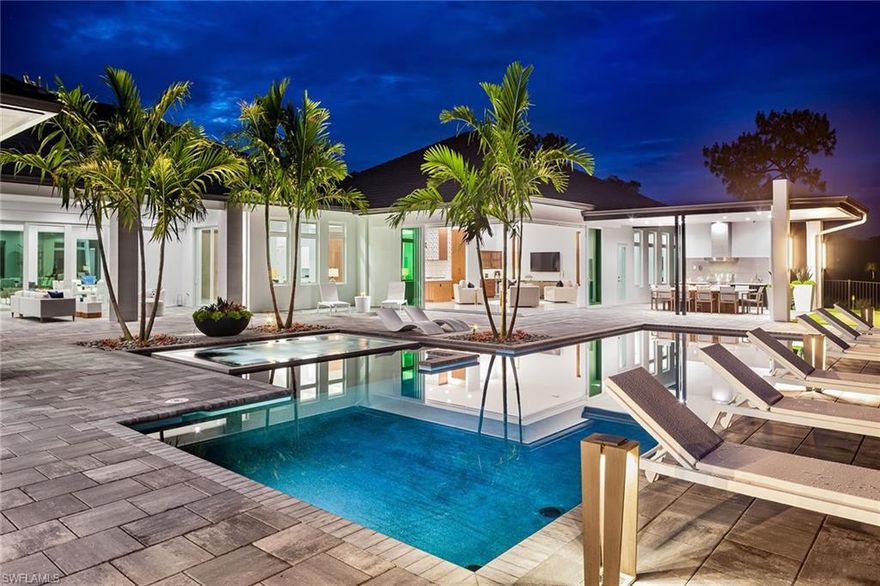 Welcome to the unprecedented 21 Palms Estate with its unmatched quality, meant to be appreciated by the most discerning buyer. A true masterpiece that stands out among all others. 21 gorgeous palm trees flank the private drive to your 1.26-acre estate. Expertly crafted with cutting-edge international design and midcentury-modern influences. An expansive 8,459-square-foot living space exudes refined modernity, unrestrained beauty and superior craftsmanship. Voluminous rooms fashioned with rich woods, imported stone and walls of glass-spill natural light throughout. This impeccable estate boasts two spacious master suites, four guest suites and a bonus space with private access. The luxury resort lifestyle permeates with a relaxed open floor plan surrounded by impressive grounds with breathtaking lake and golf course views. Enjoy the 45-foot resort-style pool and spa and expansive outdoor living. Amenities include indoor and outdoor gourmet kitchens, butler’s pantry, prep kitchen and more. Experience enjoyable entertaining or tranquil relaxation. Exceptional clubhouse and amenities. Optional golf memberships. A perfect new home to enjoy the next chapter as you have always imagined.