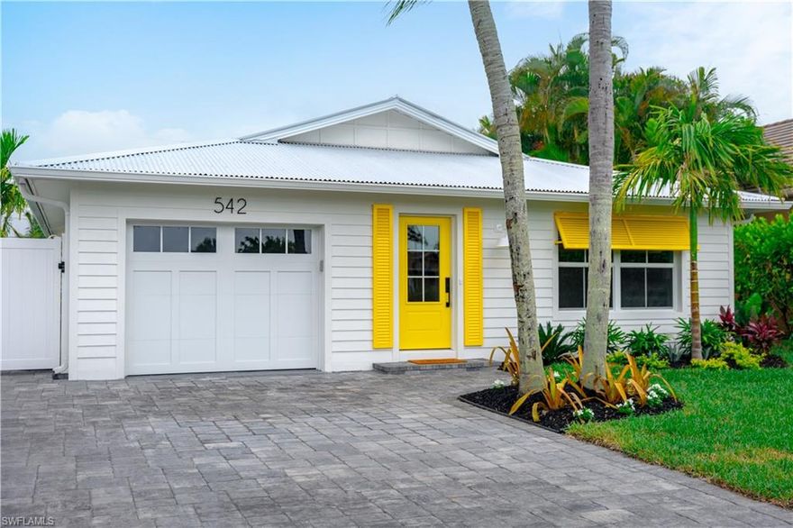 Positioned just moments from the sugar-white sands of Vanderbilt Beach, this exceptional Naples residence captures the essence of relaxed coastal luxury while offering outstanding investment potential in one of the area’s most desirable beachside neighborhoods.

Welcome to The Yellow Door Beach Cottage, where privacy and tropical elegance define the experience. Surrounded by lush, mature landscaping, the home lives like a secluded retreat, thoughtfully designed for seamless indoor-outdoor living. The open, light-filled floor plan creates an inviting atmosphere, with spacious living areas that transition effortlessly to the outdoor setting.

At the heart of the property is a beautifully designed heated saltwater pool, framed by vibrant tropical foliage that enhances both privacy and ambiance. Whether hosting guests or enjoying a quiet afternoon, the outdoor living space delivers the quintessential Naples lifestyle.

Offered fully turnkey furnished, this residence is impeccably outfitted with everything needed for immediate enjoyment or rental readiness. From stylish furnishings to thoughtfully curated essentials, every detail has been considered, allowing for a seamless transition whether as a personal retreat or income-producing property.

The home offers well-appointed bedrooms and flexible living spaces suited for full-time living, seasonal use, or as a high-performing rental. Its prime west-of-US-41 location places you just minutes from Naples’ premier dining, shopping, and entertainment, including Mercato.

With strong short-term rental appeal, a resort-style pool environment, and close proximity to the beach, this property presents a rare opportunity to own a fully furnished, move-in-ready slice of Naples paradise.

An exceptional offering where location, lifestyle, and income potential align.