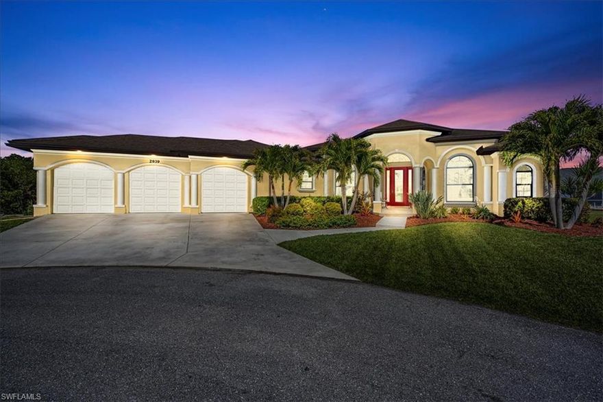 This stunning 4-bedroom, 3-bath, 3 car garage pool home with den is uniquely situated on an oversized lot bordering the Matlacha Pass National Wildlife Refuge.  It is nestled at the end of a Cul-De-Sac within in a quiet community, yet only minutes to Surfside restaurants and shopping.  Boasting a massive 2902 square feet of living space, this home features two master suites that access the oversized pool/waterfall and lanai area.   The high coffered ceilings throughout offer a feeling of elegance upon entry.  The kitchen is a walk through/open concept design for your entertaining delight, while featuring granite countertops and 42-inch hardwood cabinets.  The three-car garage with oversized 9-foot automatic doors provide for the most enthusing hobbyist or car owner!  Bring all your toys!!!  ALL ASSESSMENTS are PAID!  Now is the time to own YOUR piece of PARIDISE !!!