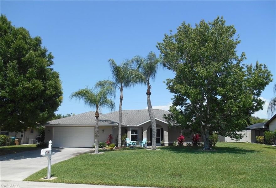 This 4 bedroom pool home is nestled in the heart of the Country Club area in Cape Coral.  It has all city utilities, a large family room with cathedral ceilings, updated kitchen with wood cabinets and granite counter tops, cathedral ceiling in the living/dinning room and a vaulted ceiling in the master bedroom.  The laundry room is spacious and the 4th bedroom is separate from the other rooms and would make for a great home office.  There are several sets of sliders leading to the spacious under truss lanai and French doors going out from the master bedroom.  The pool is a good size and the back yard is fenced with lots of tropical plants that give you privacy and the feeling like you are at your own vacation resort.  New AC in 2014, Re-plumed in 2013, Roof in 2012. 
There are some storm shutters but not on all the windows.  With a one year warranty included, this house is a must see.  Call today as it will not last long!