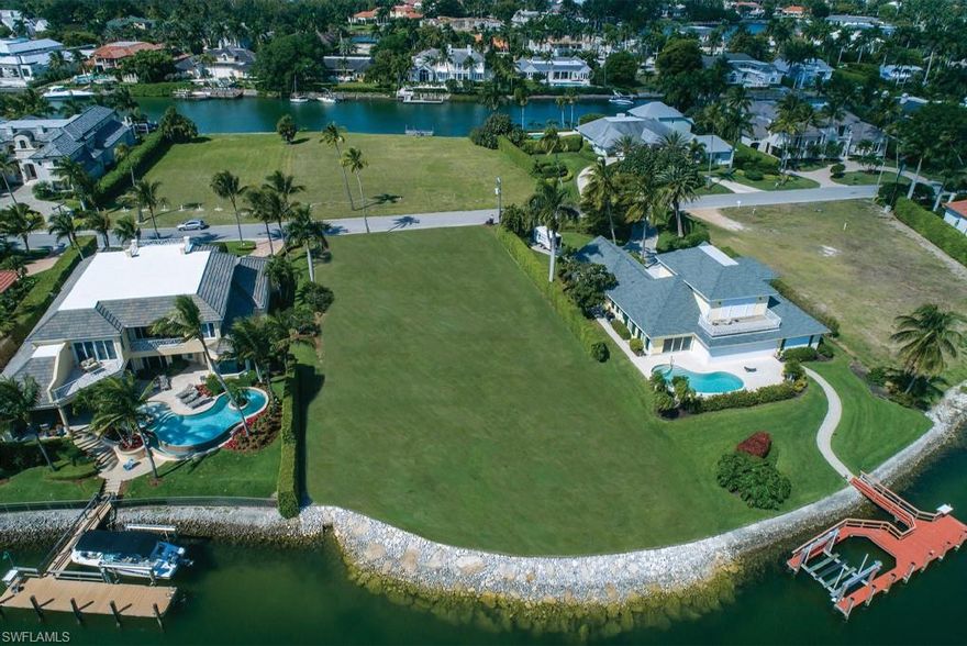 An exceptional Port Royal building site on Gin Lane with wide water frontage and beautiful water views over Hidden Bay. Brand new rip rap shoreline completed and ready for your custom dream home. An ideal location close to the Port Royal Club with protected harbor, and a quiet royal palm lined street. With a 227 foot depth and 107 feet on the water this oversized lot can accommodate the perfect custom vacation home, and plenty of room for water craft. Port Royal Club offers some of the finest private amenities; staffed fitness center, spa, tennis facilities, exquisite dining, and of course resort style service on the sugar sand beach.