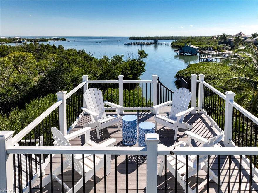 Fully Remodeled North Captiva Island Harbor View Haven with Dock, Club Amenities & Timeless Island Charm!  There’s something special about arriving by water, tying up at your own dock, and knowing you’re home. 341 Spanish Gold Lane is a fully renovated waterfront retreat where coastal charm meets modern peace of mind - designed for effortless island living and unforgettable days on the water. Set along a tranquil natural canal, this home with 4 sleeping rooms and 2 baths has been thoughtfully transformed from top to bottom. Nearly every room captures calming views across the canal and harbor toward Pine Island Sound, creating a constant connection to the water. Recent upgrades include impact-rated windows, a new metal roof, new exterior decks and railings, a whole-house RO system, and a beautifully remodeled interior that’s professionally decorated & move-in ready. The open-concept living level is anchored by a custom-designed kitchen - a true gathering place. A full wall of windows frames the water beyond the expansive screened porch, while elegant cabinetry, generous storage, and a breakfast bar make entertaining effortless. Whether it is casual mornings or sunset dinners, this space was designed for relaxation. Upstairs, the primary suite feels like a private sanctuary, complete with a walk-in closet, a spa-style bath with a custom-tile shower, and both a screened/covered porch and a sunny waterside deck - perfect for spotting manatees gliding by. Two additional guest rooms include a refined harbor-view sleeping room and a custom-built bunk room that sleeps five, ideal for hosting family and friends. Just off the screened dining porch, the charming “lighthouse room” has its own entrance and can be used as a 4th sleeping space, an office, or an artist’s studio. Climb one more level, and you’ll find the ultimate sunrise-to-sunset deck, where stargazing comes naturally, and the sound of the sea fills the night air. Outside, the home continues to impress. Your private dock provides a protected harbor for your vessel. At the same time, nearby outdoor amenities create a true island playground - an outdoor bar with swing seats & a cozy fire table lounge, kayak storage, beach gear storage, enclosed outdoor shower, and more. Everything you need for life on the water is already here. As a member of the Safety Harbor Club, this property includes full access to a community pool, tennis & pickleball courts, waterfront restaurant, beach access, and additional dockage for guest boats—bringing resort-style convenience right to your doorstep. This is the kind of home you don’t just visit… You arrive at. A rare, Gulf-access island retreat where thoughtful upgrades, harbor view living, and relaxed luxury come together seamlessly.  At 341 Spanish Gold Lane, you don’t chase the island lifestyle - you sail straight into it.  If you have been looking for a fully remodeled waterfront home with views and dockage at a lower price point, this special home is a must see!