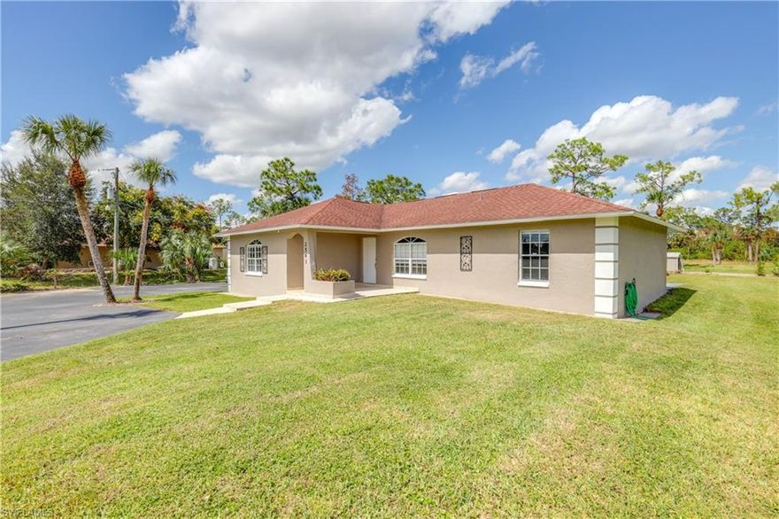 Wow... Beautiful 4 Bedroom, 2 bath home on 2.27 acres... Priced to Sell! This home is an Open floor plan with Great room, Dining area, Beautiful Kitchen with white Shaker cabinets, Quartz counters, and Island with breakfast bar. The entire home is tiled and all New interior paint. The ample sized Bedrooms are split, 2 bedrooms on each side of the home. Primary bathroom with walk in shower and dual sinks, guest bathroom with custom tile. Laundry room with sink and storage. The extra large open lanai is great for entertaining with custom outdoor kitchen with sink and bar area that can seat up to 8. Plenty of room for a Pool, Boats, and Rv's or Horses. Double aluminum Carport with electricity and water, Asphalt paved circular driveway and Completely fenced for your privacy.