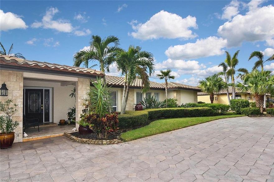 THIS home is very unassuming, but wait till you get inside!  Very spacious and on the widest canal in Palmetto Point.  The home has 2 master bedrooms, 2 living room areas (1 with a wood-burning fireplace), 2 dining areas, an amazing pool area with French doors all around, an oversized dock area that can be your own waterfront dining area with a new 25,000 lb. lift, new TREX dock decking; a fish station, water & electric.  Sellers installed new durable engineered wood floors (dog approved), a Tesla charging station, Rheem 3 ton 16 seer HVAC units in 2018.  This is a beautiful and safe home awaiting its new family to enjoy all it has to offer.  Make your appointment today...THIS type of property in THIS neighborhood on THIS canal...will not last long.