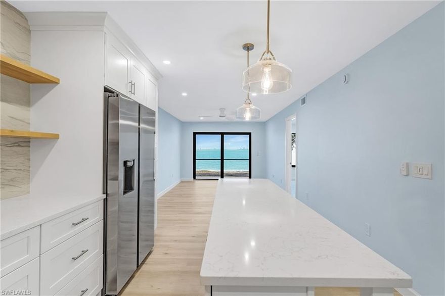 Wake up to breathtaking sunrises over the bay from this first-floor, bayfront condo, where the morning light dances across the water and sets a serene tone for the day. Sip coffee on the screened lanai and take in the ever-changing waterfront views that can be enjoyed from the living and dining areas, kitchen, and primary suite - a front-row seat to the bay from the moment you walk in.
Completely remodeled throughout, this residence feels fresh, coastal, and truly move-in ready. The redesigned kitchen features all-wood cabinetry, quartz countertops, a breakfast bar, and ALL NEW stainless-steel appliances. The updates continue in both bathrooms and throughout the home with modern finishes, updated lighting, and a crisp neutral palette designed to complement the waterfront setting. The laundry area is finished with a full-size washer and dryer and added storage.
For peace of mind, impact glass windows and sliding doors are in place. Beyond the interior, the community has invested in significant exterior upgrades including new stairs and front decks, tropical landscaping, walking decks, and boat docks, with new building paint and new pickleball and tennis courts. Residents enjoy resort-style amenities such as two pools, BBQ areas, kayak storage, and boat docks.
Situated on the east end for easy on-and-off island access when needed, you can park in your assigned space and explore by foot or bike - just minutes to bay and Gulf beaches, restaurants, shopping, and the historic lighthouse.
This is an ideal year-round home, seasonal escape, or rental-friendly investment (7-day minimum)