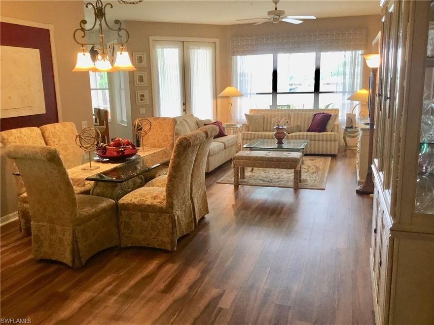 OH WHAT A VIEW !!  Enjoy happy hour on your lanai and watch the spectacular sunsets looking out over a pond and down the 12th fairway with out cart path traffic distractions.  This first floor carriage home features many upgrades.  In the kitchen you will have granite counter tops and back splash as well as new stainless appliances. New Cortec Plus flooring in the living room, dining room, den and kitchen.  The carpets in the bedrooms are one year old.  New A/C in 2014 and HWT in 2018.  Vanderbilt Country Club has a beautifully remodeled and expanded clubhouse, a new attended health and fitness center and the new Terrace Cafe for informal dining that overlooks the community pool and tennis courts. Vanderbilt is a bundled golf and tennis community with a strong financial position and is an active social community