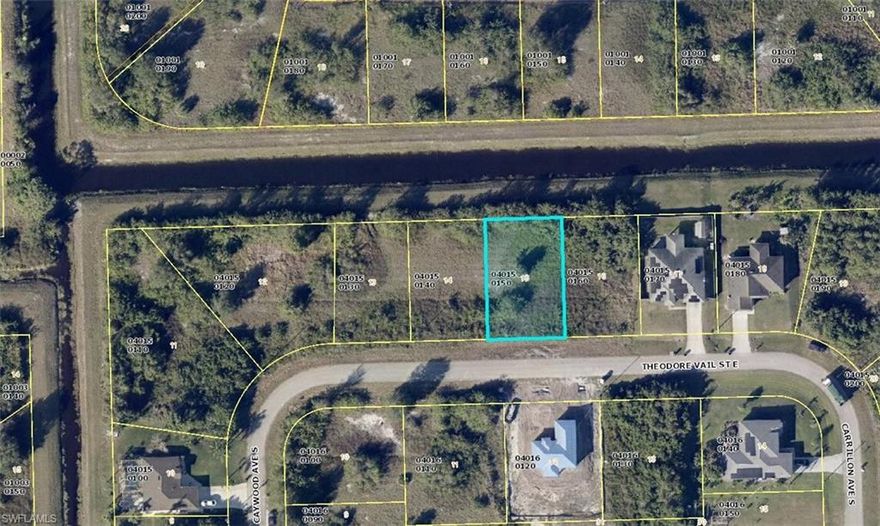 Must see desirable lot on the canal is perfect for your next investment property. This lot may also be sold with lot 613 THEODORE VAIL ST E LEHIGH ACRES FL 33974. Located in a quiet road near Homestead Rd and Milwaukee Blvd this neighborhood is in walking distance to Mirror Lakes Elementary School. On a quiet road great for walks with family and friends Take a drive by your next investment property today.
