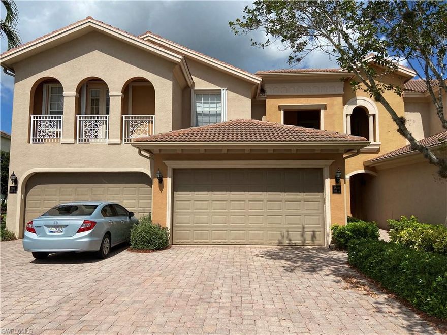 As you come up the stairs from the 2 car garage you will notice how unique this home is. It is almost 2600 sq ft .and very gorgeous. There is a large dining room that can seat 12. From the dining room, family room and kitchen, you have a view of the lake. The kitchen has granite counter tops, stainless steel appliances and a pantry.. The large lanai offers a hurricane shutter and an expansive view of the night-lit fountain. On the other side there are 2 good sized bedrooms  with a large bathroom that they share, The one front bedroom has french doors that open to a balcony. As you move up the hall there is a laundry room and a half bath. Then you open the french doors to a massive Master Bedroom Suite with a sitting room. The large master bathroom has a double vanity, a dressing table, a large tub, an enclosed water closet and a walk in shower. The master closet is 7'x16'. On top of all this these condos were built with the option to add an elevator. There is new 12 mill laminate flooring in the main living area, custom window treatments through out, the air is 1 year old and the hot water heater is one and a half years old.  Do not miss this exceptional well-cared-for home.