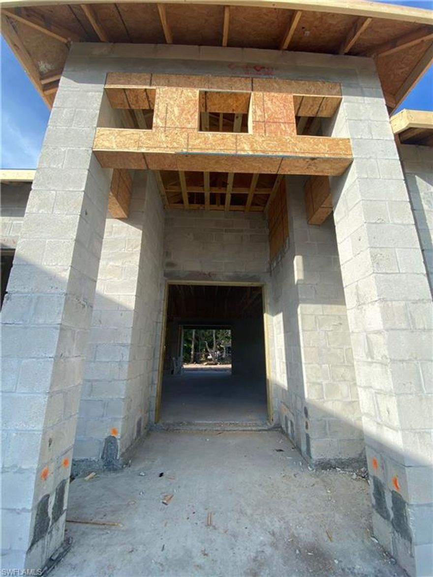 All assessments in and paid! Stunning three bedroom with den new construction home located in SE Cape Coral. Large open floor plan. Tile through out the home. Paved driveway and walkway. Homes comes with 10 year structural warranty. Pictures and features will be updated as construction progresses.