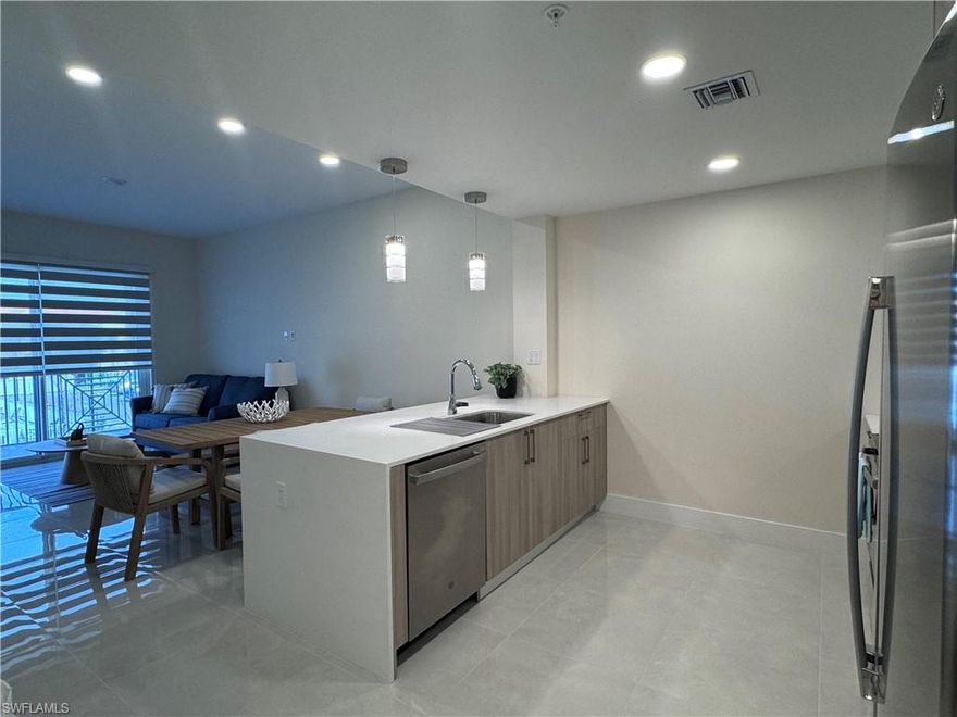 Beautiful Condo for Rent in Botanika at Bonita Fairways Discover your new home in this stunning, fully furnished 1-bedroom plus den, 2-bath condo located in the exclusive gated community of Botanika at Bonita Fairways. Key Features: Spacious Living: Enjoy 990 sq. ft. of thoughtfully designed living space, accommodating up to 4 guests and 1-2 children comfortably. Elegant Master Suite: The master bedroom boasts an en-suite bath with dual sinks, providing a private oasis for relaxation. Gourmet Kitchen: Cook like a chef in the modern kitchen featuring quartz countertops, European-style cabinetry, and a large island with breakfast bar. Open Floor Plan: Experience the airy ambiance created by 9'6" ceilings and impact windows that ensure peace and hurricane protection. Ample Storage: With closets in every bedroom and his-and-hers closets in the master suite, ou'll have all the space you need for your belongings. Convenient amenities. All appliances included washer/dryer, refrigerator,range/oven, and microwave ina sleek stainless steel finish. The apartment comes fully equipped and furnished with sheets, dishes, utensils, and everything you need for your beach vacation. As a resident, you will have access to the Bonita Fairways golf course and a clubhouse that features pools, a library, and a party room. The unit comes with one assigned parking space for your convenience