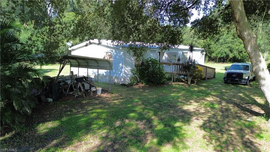 Call this large 2.87 acre homestead yours! Enjoy quiet country living in this large parcel that includes a 1558 sq ft 3/2 home in great shape with an open porch on the back. Sheds for storage on property and ample space, room for a pool or expansion. Beautiful mature oak trees give shade with the property located off paved road Pine Lane, 15 min from Clewiston out of a flood zone area in the Seven K Estates Flaghole Clewiston. Central water provided by Southshore Water Association, Glades Electric and uses septic tank system. 1.5 from each coast, this property won't last for long! Call to schedule your appointment today!