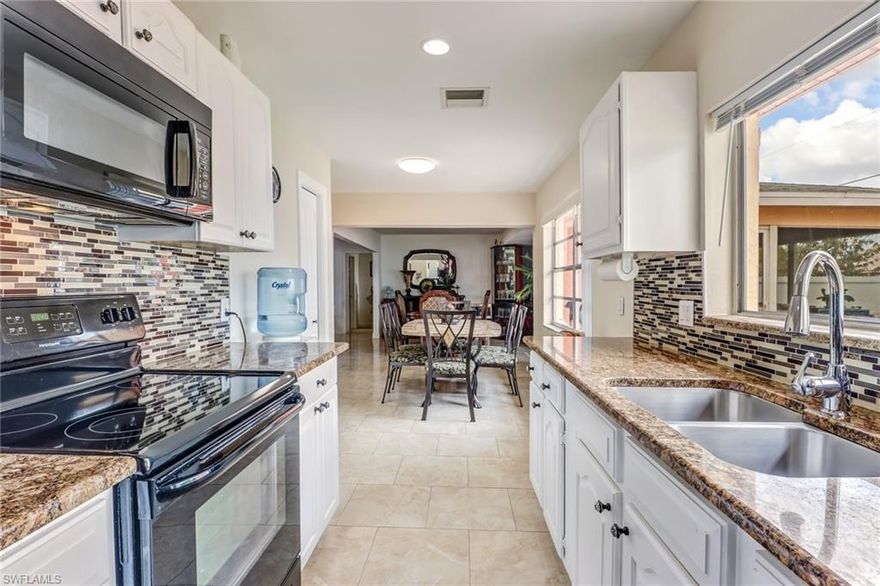 Beautiful home in the heart of Golden Gate City.  Home is open and bright.  3 bedrooms, 2 bath, formal dining, nook and living room PLUS  Garage was converted with permits to another room and a bathroom so plenty of room in this home for a large family. Huge patio perfect to build a pool in the future.  The best price per sqft in Golden Gate City.  So don't miss this great home!