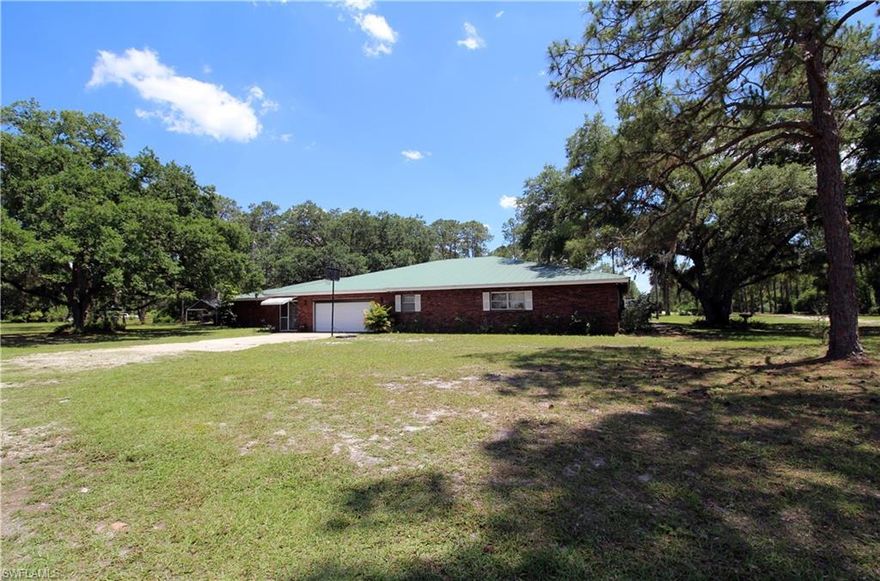 Gorgeous, tranquil, and extremely private!   This 5 bedroom plus den, 4 bath home is offered at this price on approximately 53.66 acres; Seller will split off the additional 40 acres to be sold separately for $300K.  Or you can buy the whole package for $675K!  This home has it all with over 4100 sq ft of living space, 2 master suites, a fully functional fireplace, game room, and 2 car garage. Metal Roof, brick finish exterior, marble, stainless steel appliances, and surround sound system are just some of the features.  Great for entertaining and family gatherings, the property boasts an over-sized lanai with large, heated swimming pool and integrated spa, an outside BBQ kitchen and large storage shed in excellent condition.  There's even a chicken coop!  Agents please read all confidential remarks.