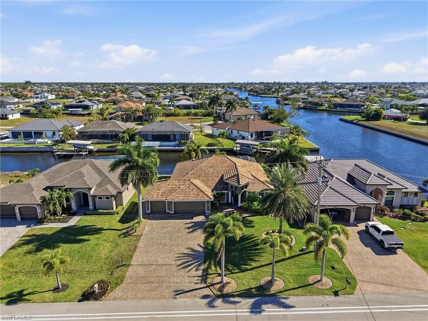 Exceptional Gulf Access Pool Home on a Rare 4-Way Intersecting Canal

Experience the best of the Southwest Florida waterfront lifestyle in this meticulously maintained and beautifully upgraded 4-bedroom + den, 2-bath, 3-car garage Gulf access residence, ideally positioned on a wide 4-way intersecting canal offering expansive water views, privacy, and tranquil surroundings. With eastern exposure, enjoy breathtaking sunrises over the water from your private outdoor living space.

This move-in-ready home features impact-resistant windows and sliders, tile throughout the main living areas, wood cabinetry, granite countertops, formal dining room, and a versatile den or flex space. The open kitchen seamlessly connects to the great room, making it ideal for everyday living and entertaining.

Step outside to a large screened lanai with a heated pool and spillover spa, perfect for year-round enjoyment. Boaters will appreciate the oversized approx. 700 sq ft AZEK dock equipped with two boat lifts (10,000 lb & 7,000 lb), offering quick access to open water and the Gulf of America. The wide canal system is known for abundant marine life including snook, tarpon, dolphin, and manatees.

The air-conditioned, tiled 3-car garage includes custom cabinetry and ample storage, ideal for car enthusiasts or hobbyists. Recent upgrades include a tile roof, whole-house reverse osmosis system, pool heater, updated landscaping, low-voltage exterior lighting, paver driveway, and whole-house gutters.

Located in a quiet and desirable Cape Coral neighborhood with bike and walking paths, and close proximity to Joe Stonis Park, Sirenia Vista Park, kayaking, pickleball, golf, shopping, and dining. Easy access to Burnt Store Road, I-75, Punta Gorda Airport.

Offered furnished or unfurnished. Whether you are upsizing, downsizing, relocating, or seeking a Gulf access investment, this property delivers quality, location, and lifestyle.

Schedule your private showing today and experience Gulf Coast living at its finest.