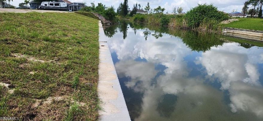 Seawall is in and the lot is ready for you to build. This beautiful freshwater lot has WESTERN REAR VIEW for those spectacular SWFL sunsets. The neighborhood is up and coming, with new homes being built all around. This lot affords you access to fishing, boating and water sports right outside your back door. Close to beaches, shopping, restaurants and all the activities SWFL has to offer. ***Both lots on either side of this lot are also available for sale, so if you're looking for space to roam, this lot and the two beside of it will definitely give you all the space you need*** Don't miss this opportunity to own your piece of Paradise!