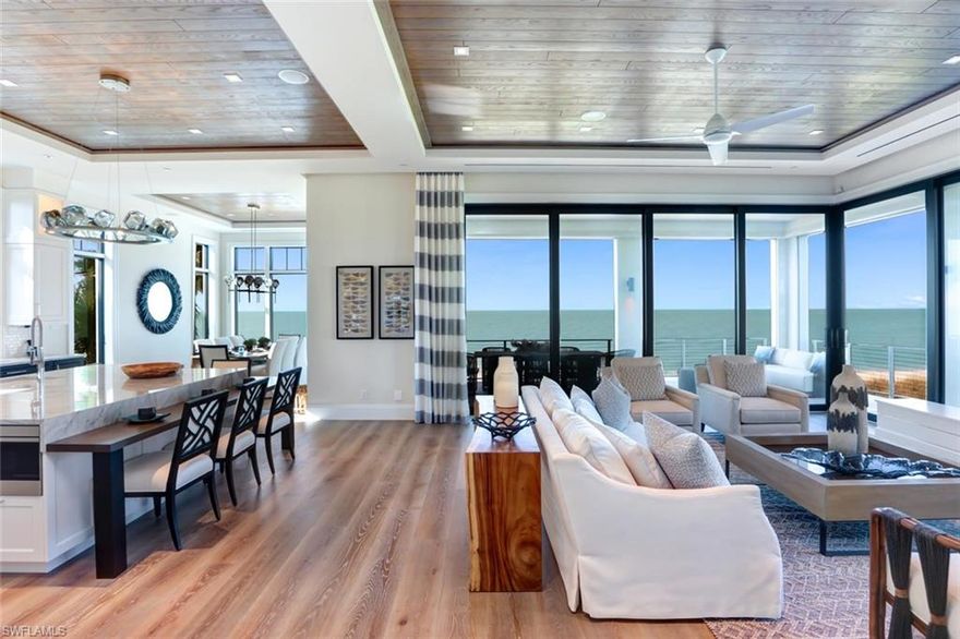 Rarely available direct beachfront, FIRST POSITION, 2018 NEW CONSTRUCTION in Barefoot Beach—by the highly regarded Windover Development. Nestled in Collier County’s gated Barefoot Beach community, this state-of-the-art North Naples masterpiece boasts only the finest features, finishes & décor, with the Gulf of Mexico as the backdrop. No details overlooked from the Gulf view chef’s kitchen with Wolf/Sub-Zero appliances & quartzite counters, & white oak hardwood floors & wood-paneled ceiling features, to the Creston smart lighting & home automation. Offered fully furnished & decorated in a stunning coastal contemporary motif by celebrated Freestyle Interiors. Delight in an open floor plan opening to the beachfront entertainment deck with outdoor kitchen: seamless indoor/outdoor beachfront living. This 5,700+ sq ft estate includes a bonus Cloud room, 3 beachfront lanais (one with fire pit feature), garage for 7 cars & private elevator. Built to the most current & stringent codes with concrete block construction, Andersen hurricane impact windows, motorized screens, storm shutters & sliders, plus aluminum snap-clad metal roof system. A showcase of visionary design by Kukk Architecture.