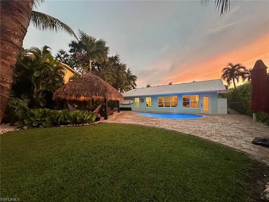 Is it time to Tiki? Are you ready??

Ideally located in a small waterfront community off the historic McGregor Blvd. corridor, this home offers privacy and convenience for future owners.  A short, 5-minute boat ride home from the Caloosahatchee and you're raising your boat up under the canopy on the 7,500 lb lift and dock that was installed in 2016.  Enjoy a swim in your salt water pool all year around with the high performance pool heater that was added in 2023.  When your ready to enjoy some shade; relax and listen to the palm trees blowing in the wind under your oversized authentic Tiki hut that was carefully crafted in the Fall of 2021.  

When it's time to head inside, step in under the standing-seam metal roof that was installed in the Winter of 2021 and enjoy the comfort of the 4-ton Rheem AC system that was installed in the Spring of 2022 followed by the R-38 insulation that was added in early 2024 to further improve efficiency. Completing the list of big-ticket improvements on this property was the addition of all impact doors and windows in May of 2024 to provide peace of mind and ease of ownership.  If one more dip in the pool is desired at night, do so while enjoying the multi-color pool light that was replaced when the pool was resurfaced in 2021, all the while enjoying the privacy afforded by extensive mature landscaping helping to create the "island-like vibe" while entertaining friends and family under the tiki.

When it's time to escape the heat, take advantage of the extra parking on the side of the home to store your large motorhome, toys or trailers for all your hobbies and fun.  As you pull away, remember this home did not flood during hurricane Ian! If your ready to Tiki, come take a look! Make sure to ask about the Seller's grandfathered flood policy.