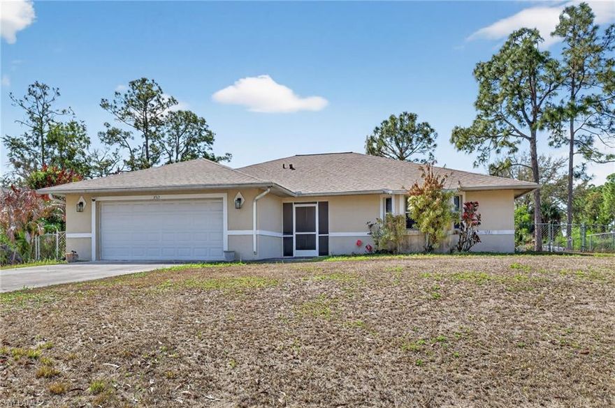 This home offers a great combination of price, size, location and no HOA fees that won’t be found elsewhere. Situated on a lot almost 20% larger than others in the neighborhood, and a fully fenced backyard, this is an affordable home with room to roam for your family and pets. The roof was replaced 2-1/2 years ago so you are good to go! Your main living space is a large great room, with a vaulted ceiling and French doors leading to the tiled and screened lanai. The split floor plan offers privacy, with an oversized owner’s suite which is brightly lit by southern and eastern windows, a tray ceiling, and a spacious walk-in closet as well as a second closet. The master bath offers dual sinks and a beautifully tiled shower. The two guest bedrooms are also large and well lit. The eat-in kitchen allows for a table large enough for the whole family. Just a few blocks from Sunshine Blvd. and nearby Lee Blvd. means you are at Publix in 10 minutes, downtown Ft. Myers in 25 minutes, and at the airport in 30 minutes. Come see why this is the best single family home value in Lehigh Acres.
