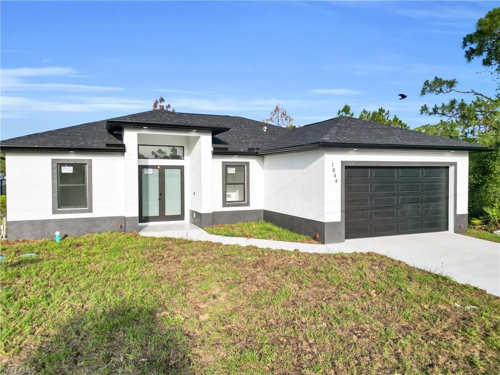 Photo of 538 Lone Star LN, LEHIGH ACRES, FL 33974 (MLS # 225083750)