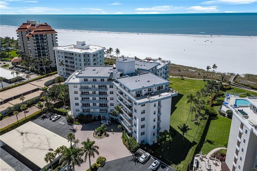 Discover an immaculate, customized coastal retreat with captivating beach and Gulf views in the charming Sunset House on Marco Island. Ideally positioned directly on the island’s award-winning crescent of white sand, this beautifully renovated one-bedroom, one-bath residence enjoys western exposure, glowing sunsets, swaying palms, and an open-concept design that maximizes space and natural light, ideal for a serene island escape. The bright interior features updated tile flooring throughout, recessed lighting, custom built-in shelving, and impact-resistant doors and windows for added peace of mind. The kitchen is thoughtfully appointed with quality white cabinetry, under-cabinet lighting, a mosaic tile backsplash and stainless-steel appliances, including a range, microwave, dishwasher, and a refrigerator/freezer updated in 2021. The living area flows seamlessly to a private balcony, where pool and beach views create a picture-perfect backdrop for relaxing or entertaining. The owner’s suite offers privacy with pocket doors, a built-in Murphy bed and mirrored closet doors. A spa-inspired bath completes the retreat with a walk-in shower featuring a rain shower head, floor-to-ceiling tile with niche, and a sleek glass enclosure. White plantation shutters throughout add a refined coastal touch. Residents of Sunset House enjoy resort-style amenities, including a large heated beachfront pool, an updated social room with kitchen and library, a barbecue area and a private boardwalk to the beach. This sought-after beachfront building offers an intimate, peaceful atmosphere with convenient features such as bike and beach-chair storage and covered, reserved parking. Go directly onto the sand to savor the Gulf’s turquoise waters, ideal for strolling, swimming, sunset watching, fishing or beachside yoga. Marco Island’s vibrant lifestyle awaits nearby with yacht clubs, marinas, golf, tennis, pickleball, dining, boutiques, parks, museums and an executive airport, with easy access to Naples and all of Southwest Florida’s best attractions. Schedule your private showing today.